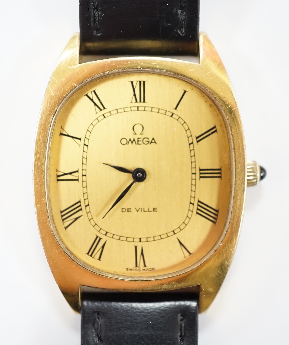 A gentleman's steel and gold plated Omega De Ville manual wind dress wrist watch, with oval Roman dial, on a leather strap, with gold plated Omega buckle, case diameter 30mm, no box or papers. Fair condition.